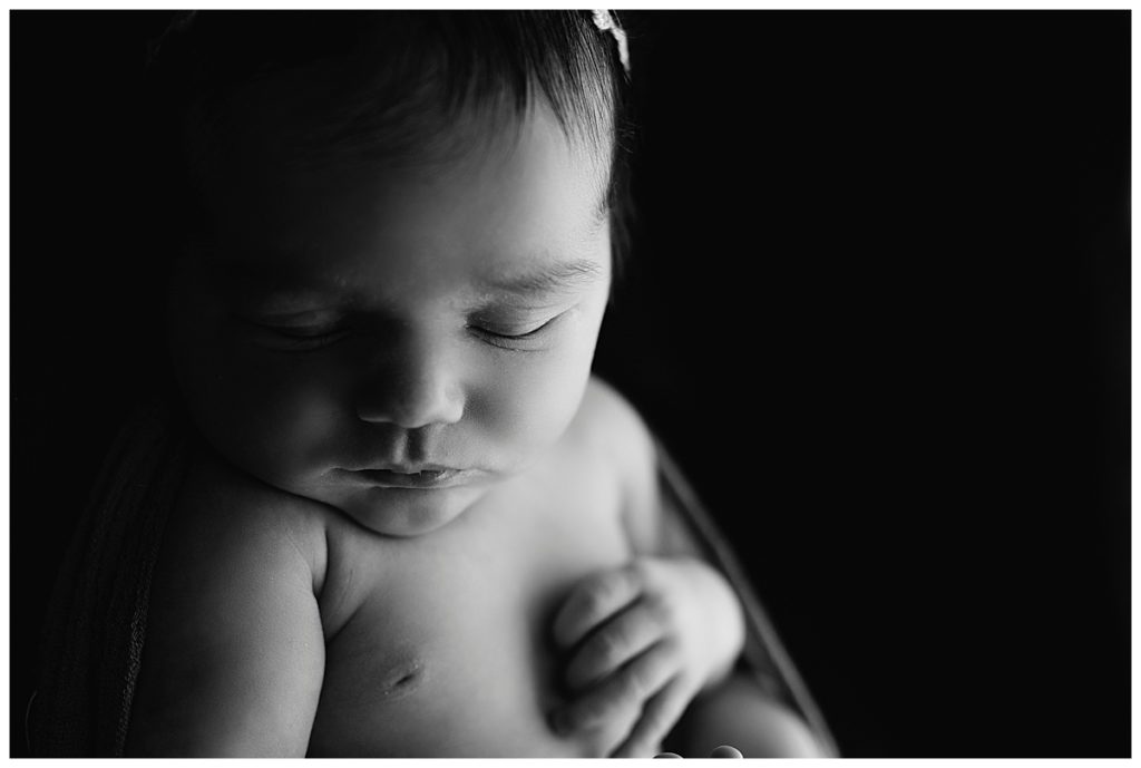black and white image of baby girl sleeping